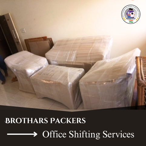 Office furniture wrapped in protective plastic for relocation with a sign of office shifting services